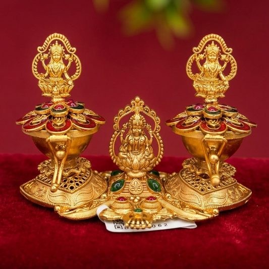 Gold-colored religious statues on a red background
